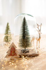 Christmas greeting card. Christmas tree branch on glitter golden bokeh lights background. New Year concept. Copy space.