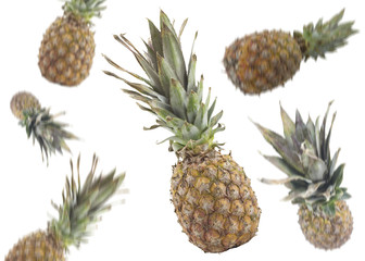 Falling pineapple on white background