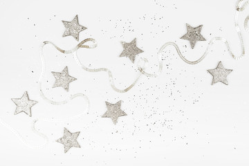 Christmas balls, pink and silver decorations on white background.