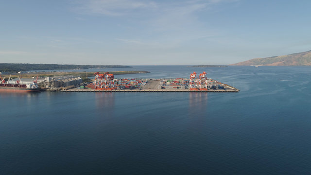 Sea cargo port with cranes, docks, containers in Subic Bay. Philippines,Luzon. Aerial view: cargo port and container terminal.