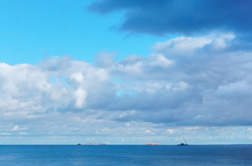 Obraz premium A ship is on the horizon. Waves on the sea. Fishing boat at sea.