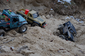 radio-controlled car and road situation illustration help, car pulls with a cable helps to go, rc car © lanarusfoto