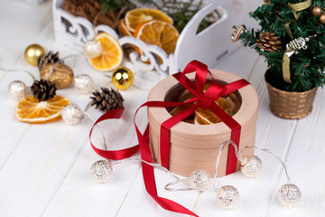 Christmas holidays composition  with copy space for your text. Christmas gift box in craft paper with red ribbon.