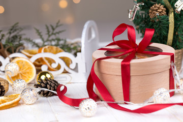 Christmas holidays composition  with copy space for your text. Christmas gift box in craft paper with red ribbon.