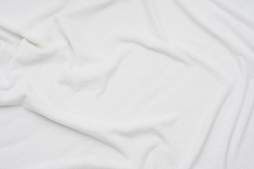 Fototapeta premium white crumpled blanket, top view