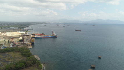 Aerial view of shipyard with ships in docks, cranes and warehouses. Batangas Shipyard, Philippines, Luzon.