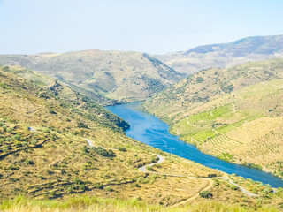 Fototapeta na wymiar River through the douro valley in Vila Nova de Foz Coa, Portugal