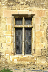 Fototapeta na wymiar window on old castle wall