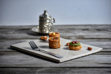 Turkish cofee and Middle Eastern dessert with on a stone plate
