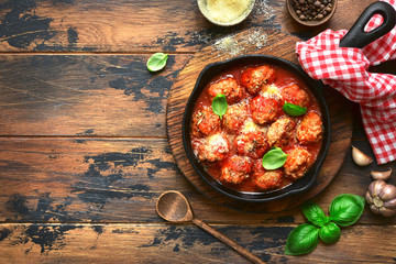 Meatball in a tomato sauce in a skillet pan.Top view with copy space. - obrazy, fototapety, plakaty