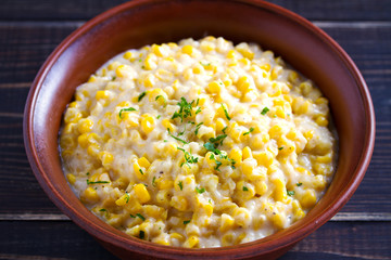Sweet and creamy corn in bowl. Corn dish. horizontal