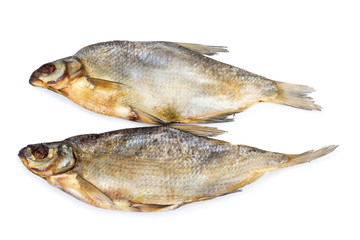Dried salted fishes isolated on white backdrop.