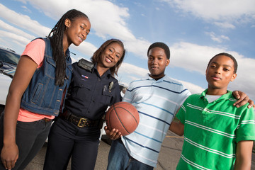 Policeman talking to kids on the street