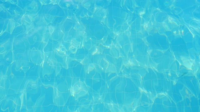 Celeste sea waters play and shine with tints and shadows in a swimming pool  