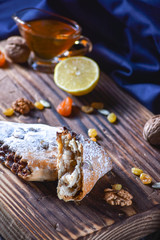 Roll cookies with nuts on a wooden table. Georgian dessert.