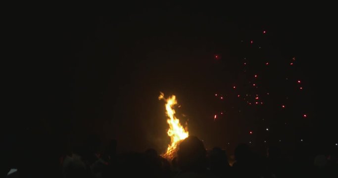Fireworks exploding over heads of crowd