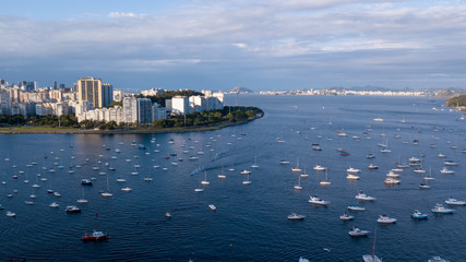 Aerial view on the drone cove of Botafogo in Rio de Janeiro, sea and boats in the late afternoon