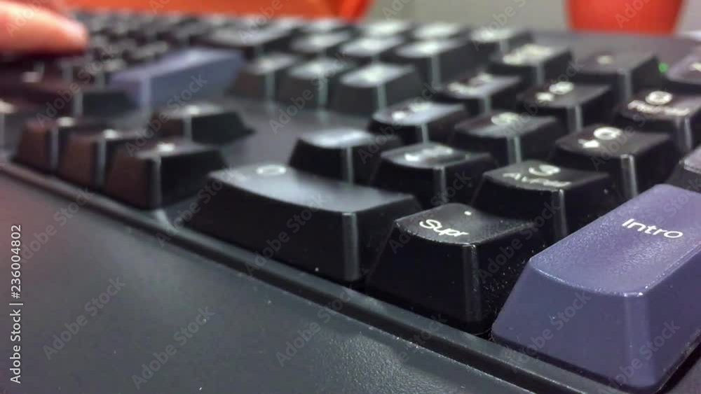 Poster the hands of a person typing on a computer keyboard