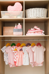 Wardrobe with cute baby clothes and home stuff