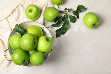 Composition with juicy green apples and space for text on table, top view