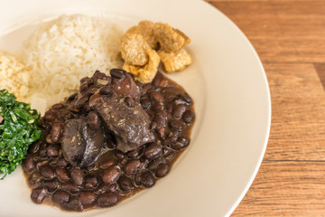 White dish with ingredients of feijoada, typical food of Brazil