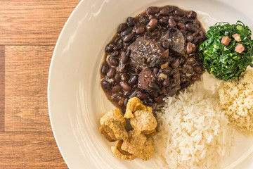 White dish with ingredients of feijoada, typical food of Brazil