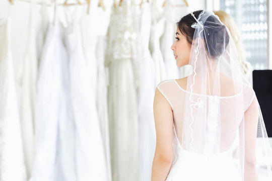 Asian Portrait Of Cute Lady Smiling Happy Wearing Wedding Dress