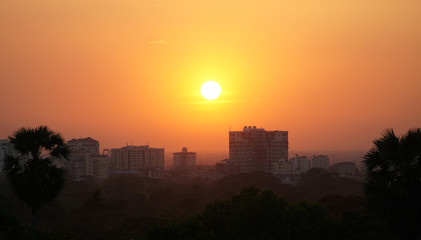 Fototapeta premium Sunset behind an apartment block in Yangon, Myanmar.