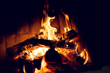 Fire in an old home fireplace.