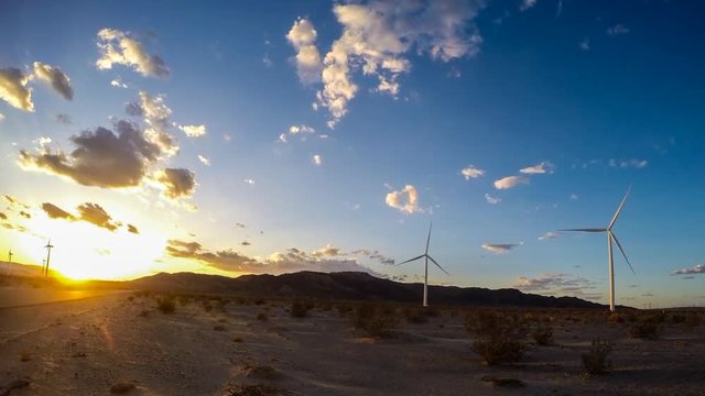 Beautiful setting sun behind the Ocotillo wind farm in the desert of southern California.