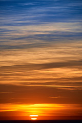 Naklejka na ściany i meble burning clouds in the evening sky after sunset