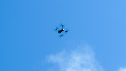 Naklejka na ściany i meble Drone flying with blue sky