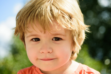 Child portrait. Cute little boy. Close-up portrait of cute, smiling, caucasian white boy. Child with beautiful eyes, concept of childhood education, happy family or parenting. Kid enjoying life.