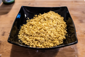 Plate with millet seeds soaking.