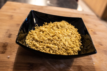 Plate with millet seeds soaking.