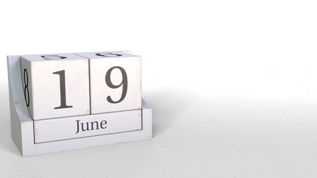 Wood cube calendar shows June 19 date, 3D animation