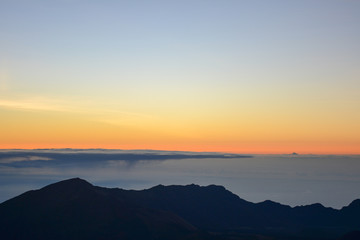 Fototapeta premium Sunrise at the summit of Haleakala volcano on the island of Maui, Hawaii.