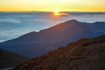 Sunrise at the summit of Haleakala volcano on the island of Maui, Hawaii. - Powered by Adobe