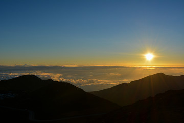 Sunrise at the summit of Haleakala volcano on the island of Maui, Hawaii.