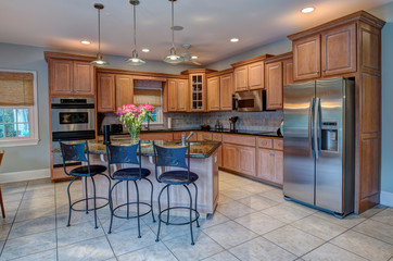 Beautiful kitchen with island and stainless steel appliances.
