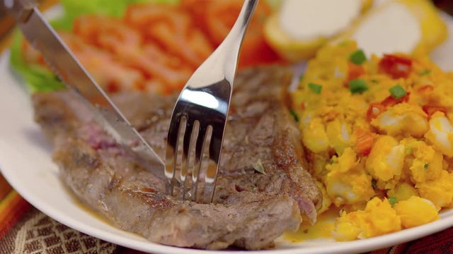 Meat Steak with corn tomatoes, lettuce and potatoes
