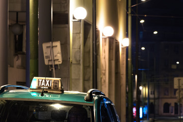 Taxi sign on the roof at night in Lisbon.