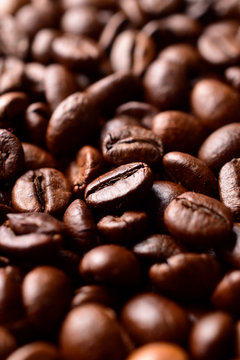 macro image of roasted coffee beans texture background , vertical