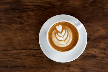 Latte Coffee art on the wooden table