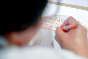 Caligraphic practise with bush and paper.