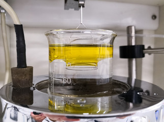 Force tensiometer measuring interfacial tension between water and oil by the Du Nouy ring method....