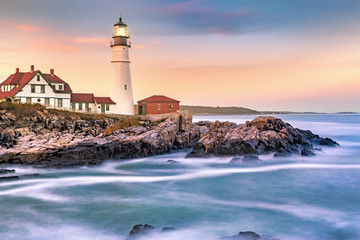Portland Head light at dusk. The light station sits on a head of land at the entrance of the...