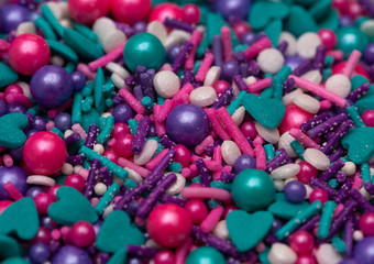 A Background of Mermaid Colored Sprinkles of Various Shapes and Colors