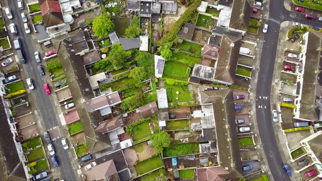 Drone footage of CABRA, PHIBSBOROUGH, DUBLIN, IRELAND, with symmetrical lining of houses and tress.