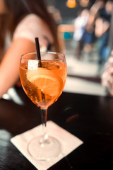 Ready alcoholic cocktail on the background of spice bars in a luxury bar, club, night club, restaurant, pub, evening, weekend